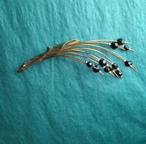 2/10 $ Gold and Black Feather Brooch with Bead Accents